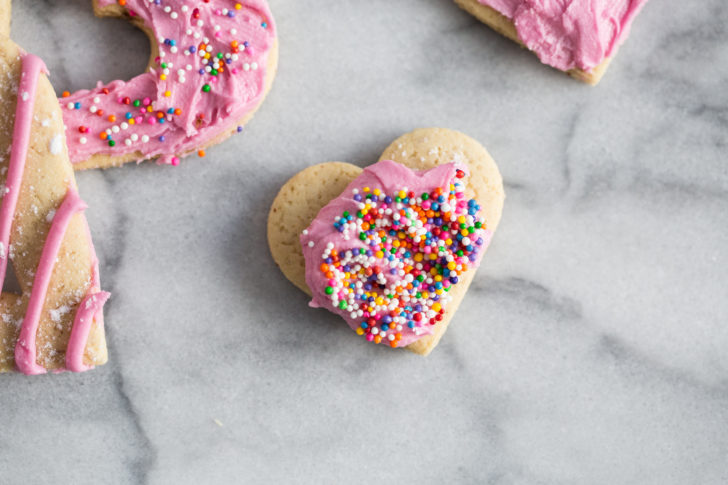 Heart shaped sugar cookie with coloured sprinkles