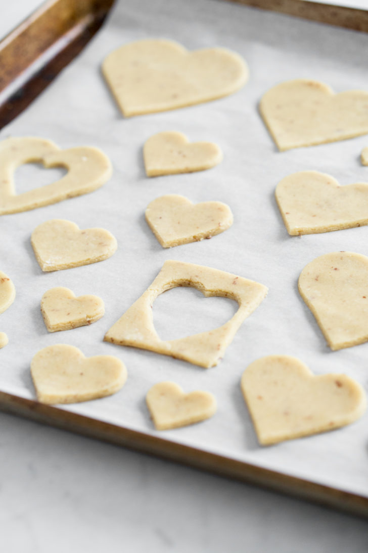 Heart shaped sugar cookies on baking sheet