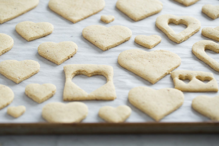 Heart shaped sugar cookies on baking sheet