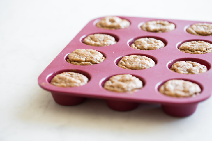 Muffins in red silicone muffin tray
